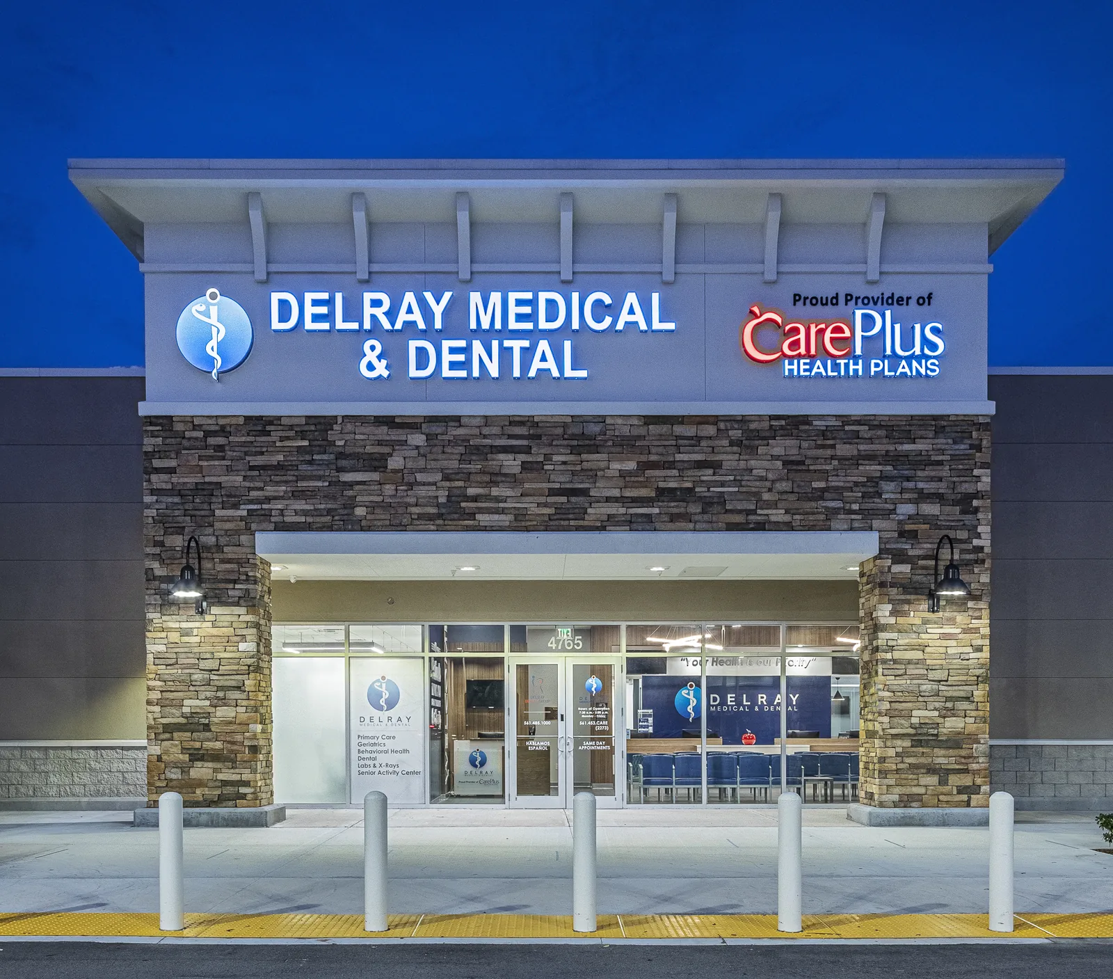 Delray Medical &amp; Dental storefront with stone facade at dusk.